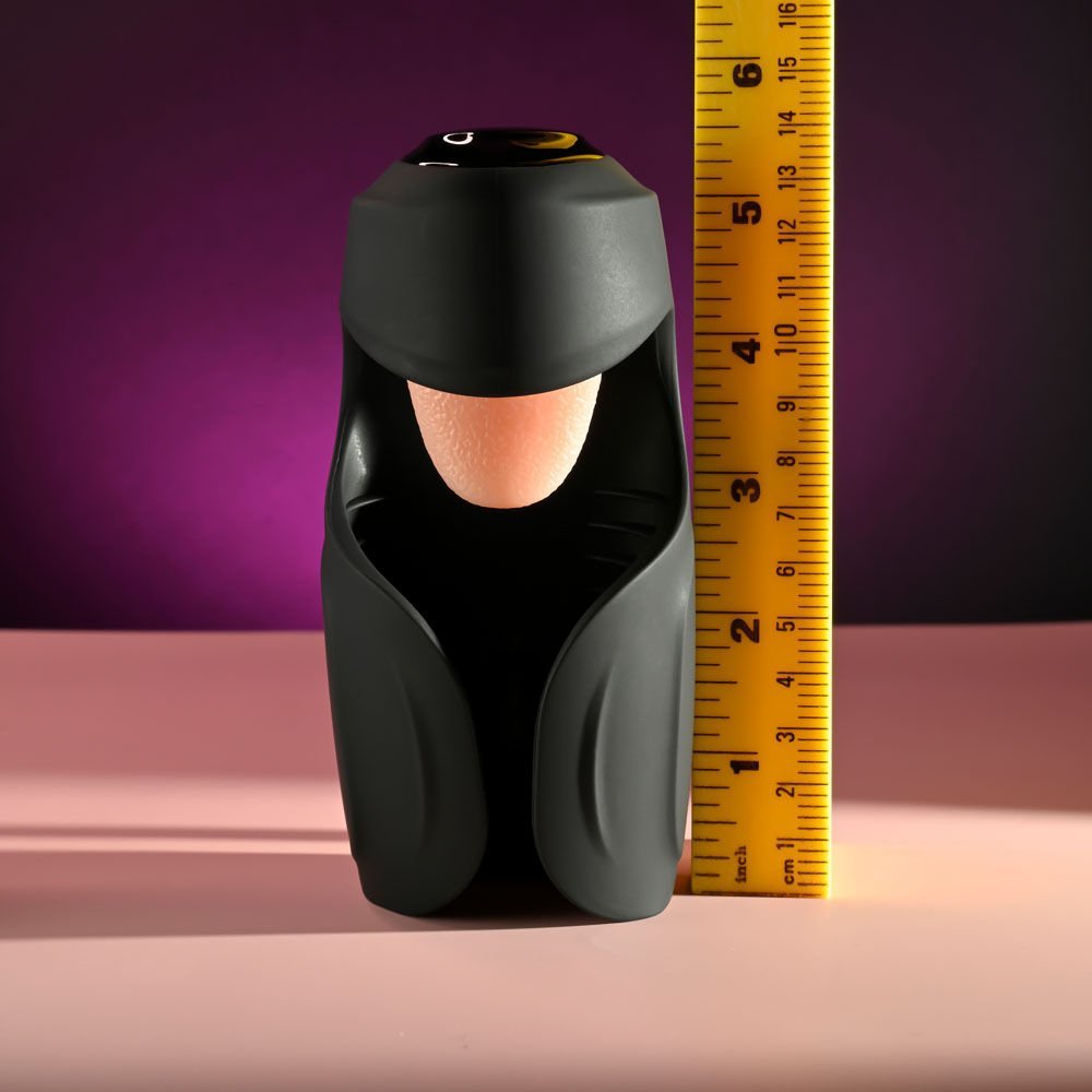 Front view of the Zero Tolerance Lick the Tip vibrating masturbator with a ruler beside it for size reference, on a pink and purple background | Flirty Bay adult store Perth.